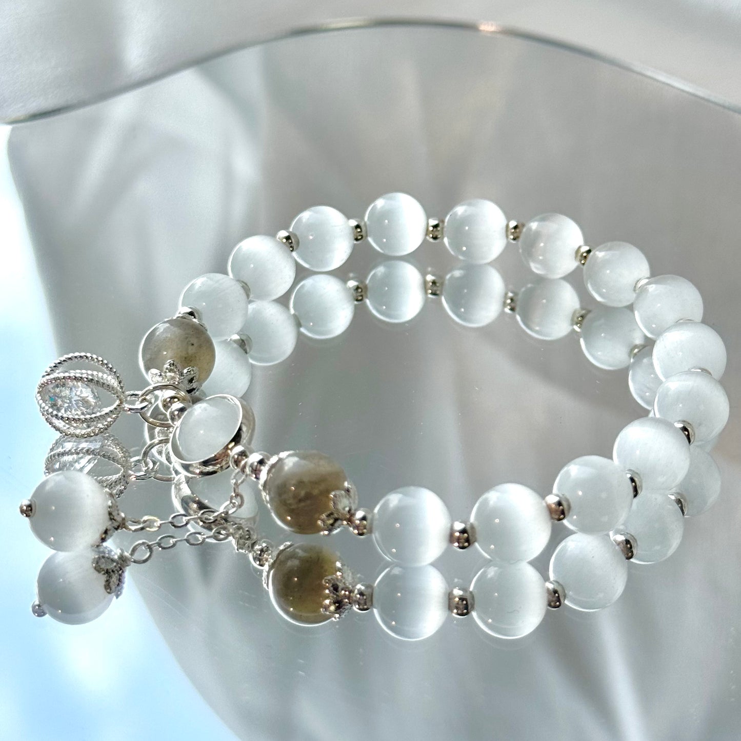 Glücksperlenarmband aus Katzenauge und Mondstein